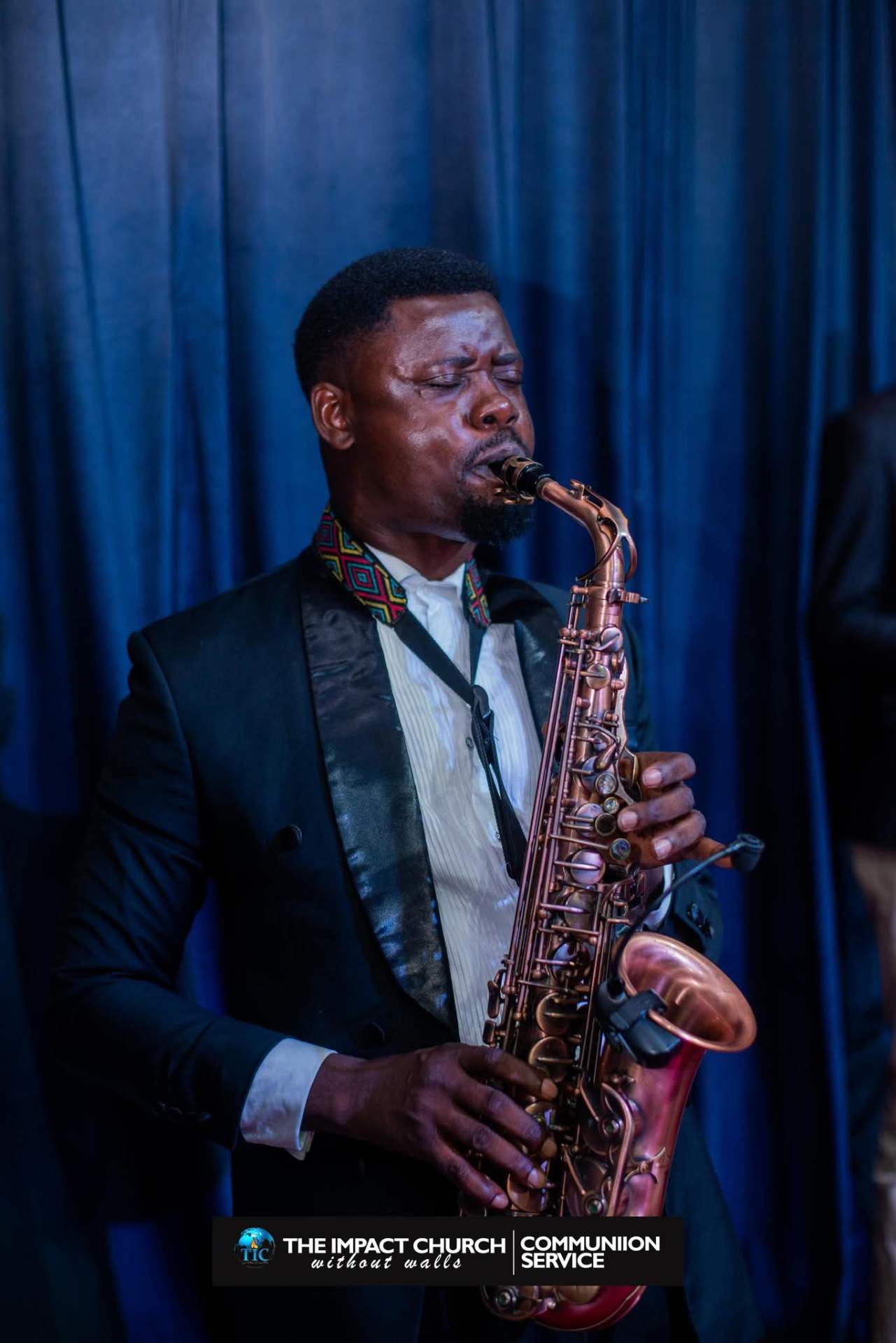 Big John on stage with copper saxophone