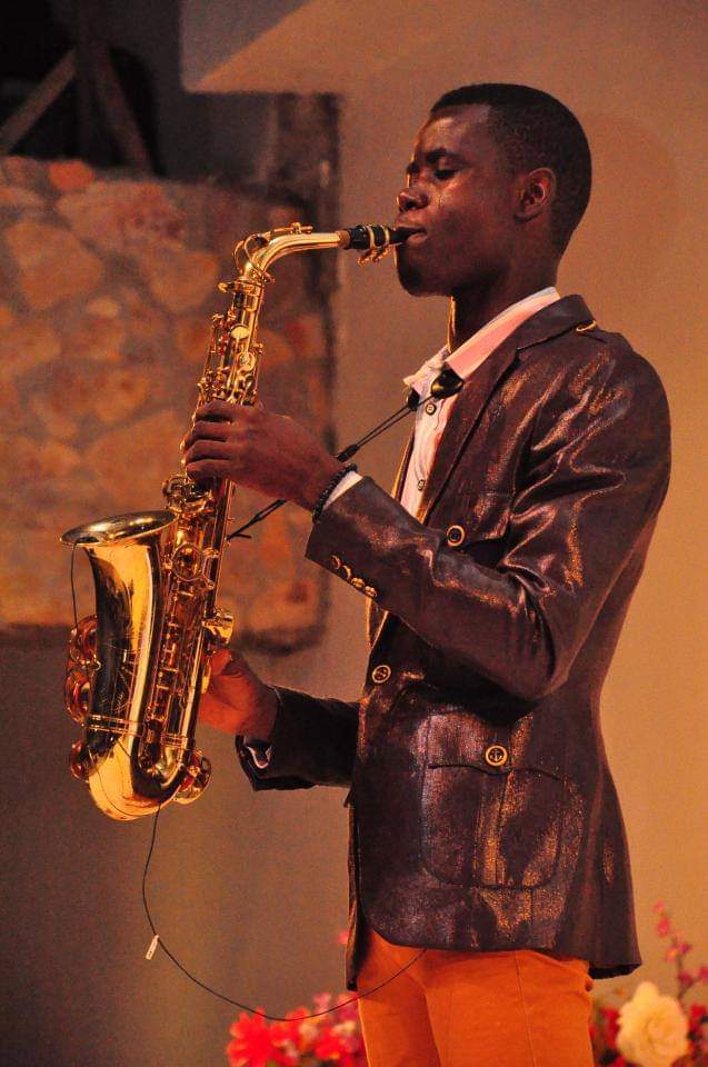 Big John performing on stage in copper jacket
